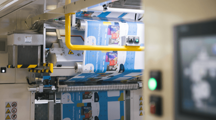 Digital printing press producing flexible packaging rollstock for CPG products at a U.S.-based facility